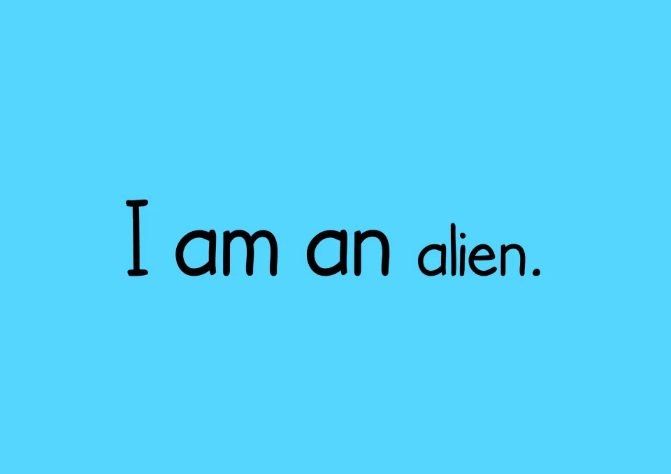 Sentence reading card showing "I am an alien." for students to read aloud and rebuild with their word cards