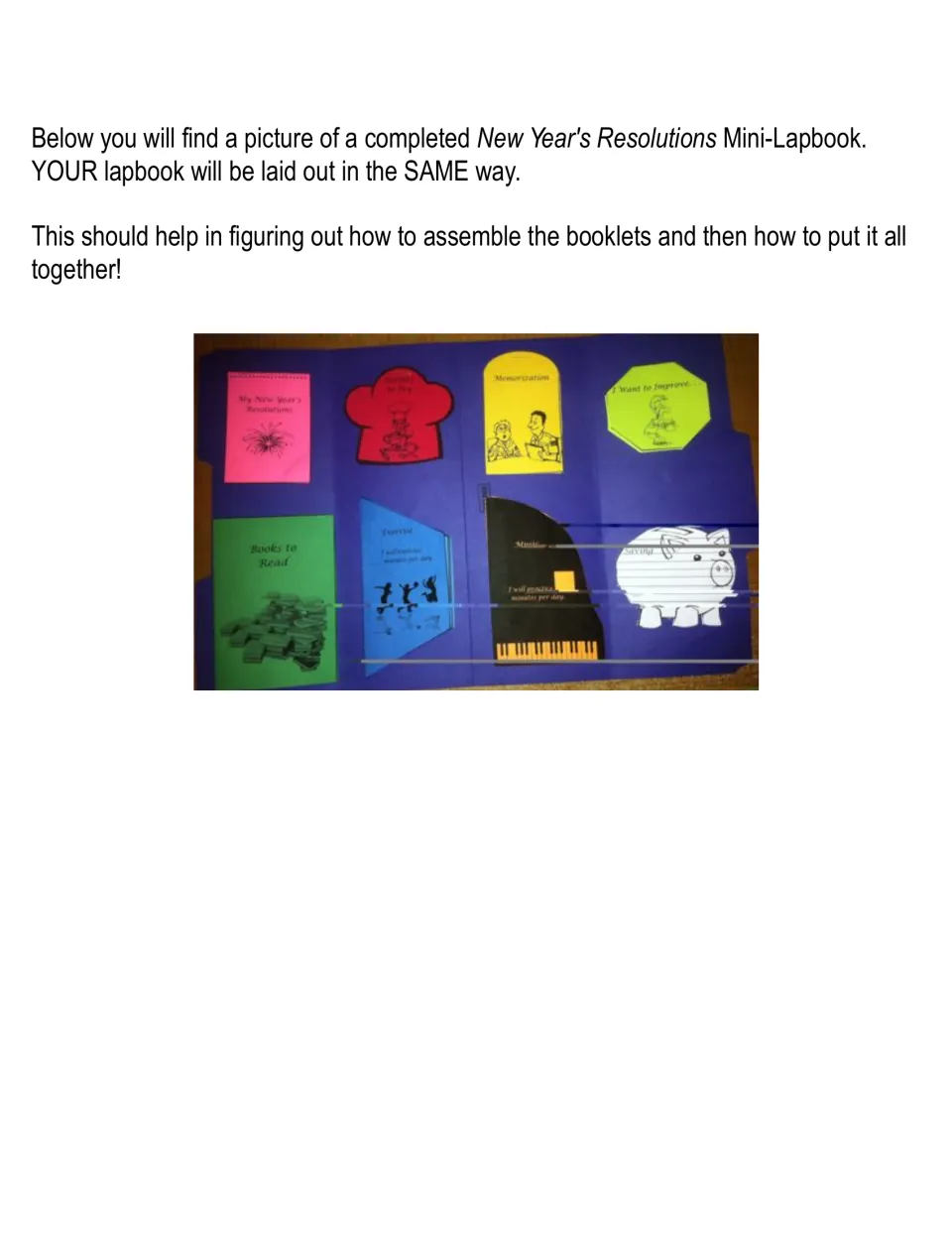 Completed lapbook example: a blue folder holding all eight colored booklets, including piano and piggy bank shapes