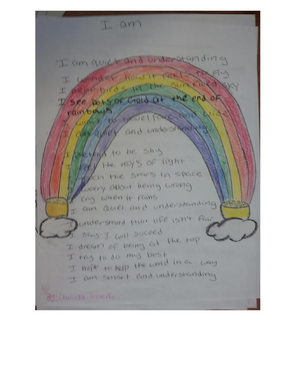Student I Am poem 'I am quiet and understanding' written over a crayon rainbow drawing with pots of gold on clouds