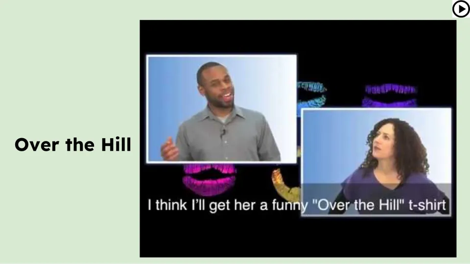 Video lesson slide shows two speakers discussing a funny birthday T-shirt that uses the lesson's idiom