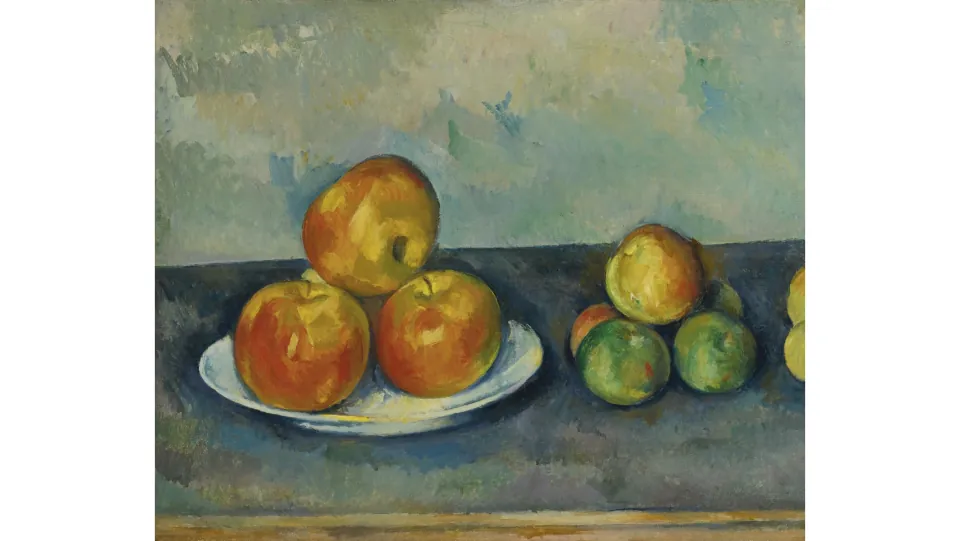 Art review slide showing a still life of three apples on a white plate beside a separate group of fruit