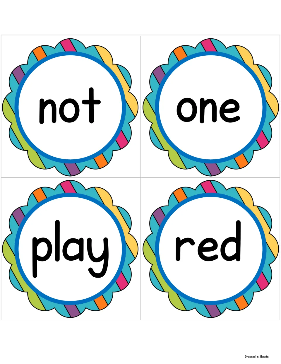 Sight word cards for not, one, play and red, each in big black print in a rainbow scalloped circle for word recognition