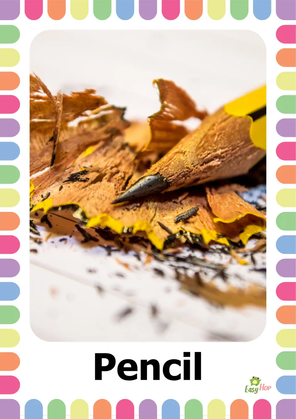 School supplies vocabulary flashcard labeled 'Pencil,' showing a sharpened yellow pencil and wood shavings