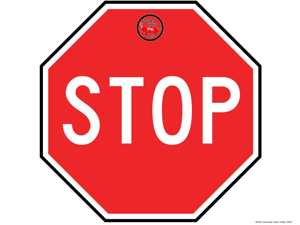 Printable STOP sign for the scooter board city activity uses a red octagon with large white lettering.