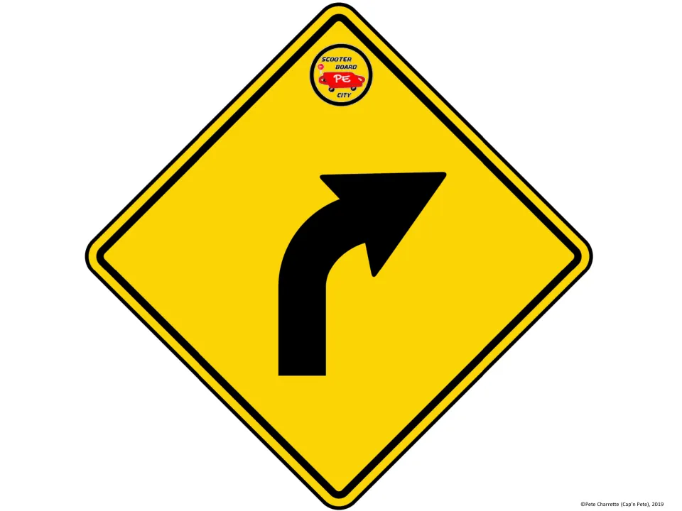 Printable right-curve warning sign for the scooter board city activity shows a black arrow on a yellow diamond.