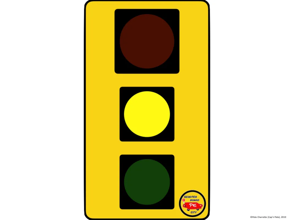 Printable yellow traffic light sign for scooter board city signals riders to slow down through the intersection.