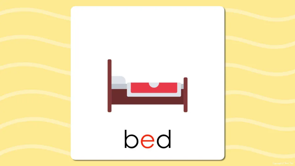 Short e flash card reveal: the bed picture now labeled bed, with the vowel e in red so students check the short e sound