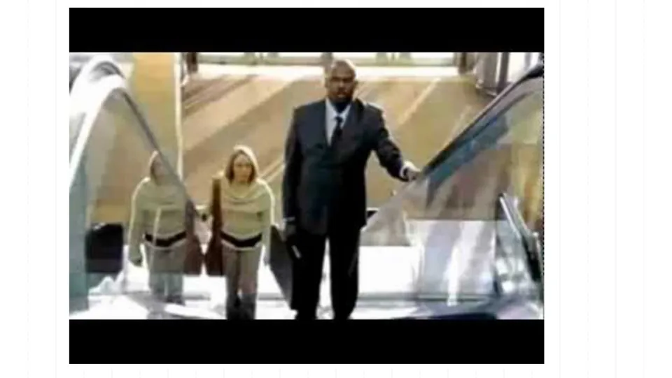 Escalator scene in the personality lecture showing two people on the steps after the learned helplessness slides