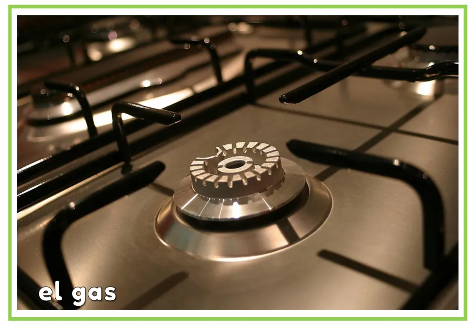 Spanish vocabulary flashcard labeled 'el gas' (gas), showing a close-up of an unlit kitchen stove burner