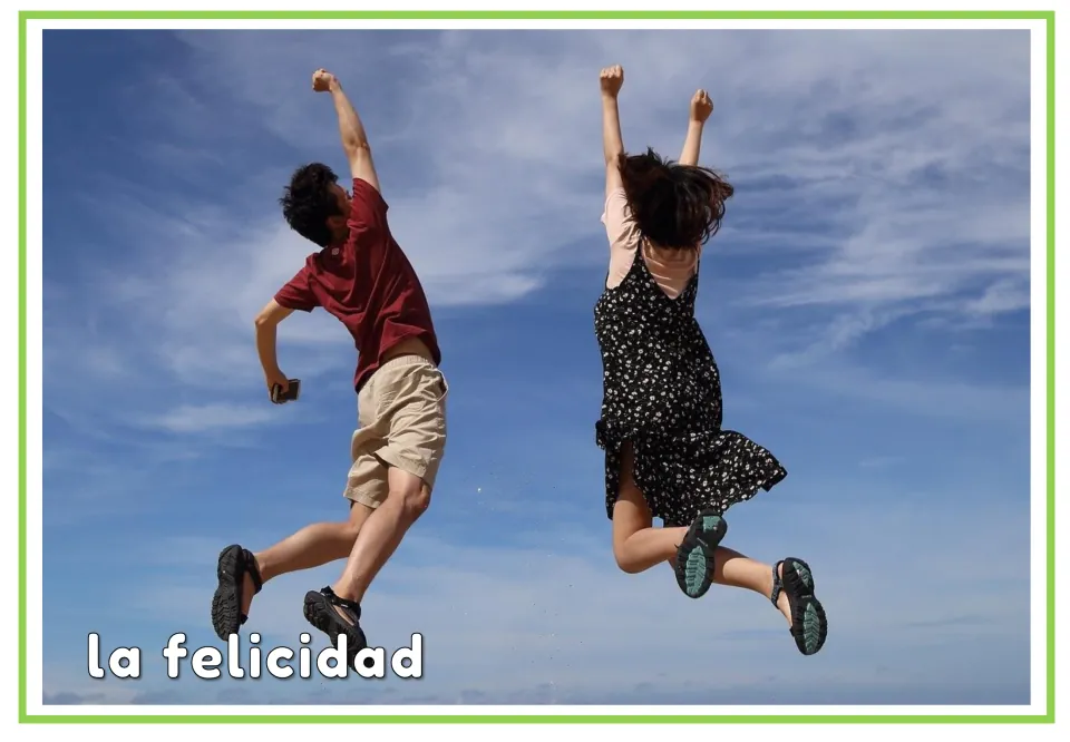 Spanish emotions flashcard labeled “la felicidad” (happiness), showing two people jumping with raised arms