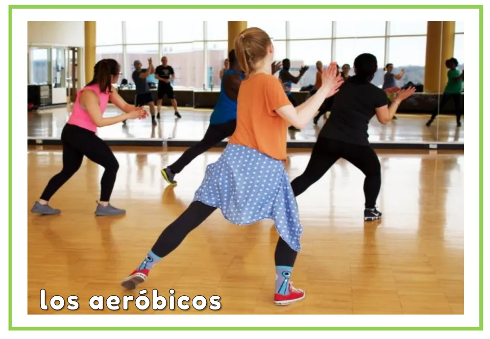 Spanish gym vocabulary flashcard labeled 'los aeróbicos' (aerobics), showing a group exercising in a studio