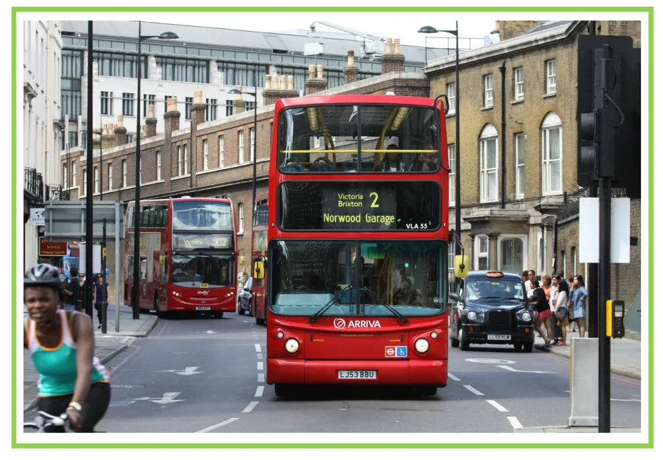 Unlabeled Spanish transportation flashcard showing a red double-decker bus, paired with the next card