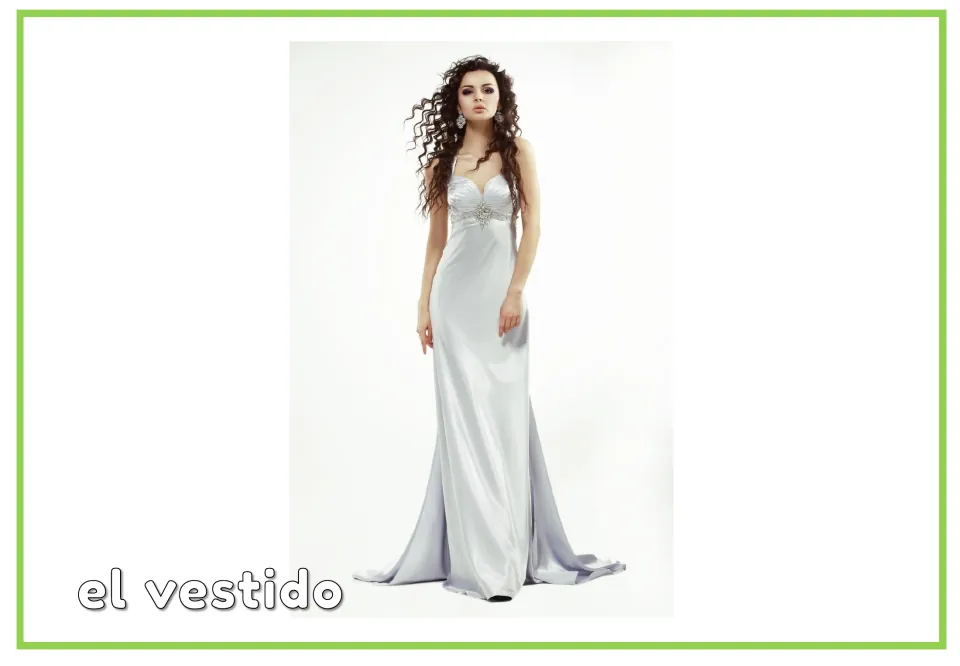 Vocabulary card labeled "el vestido" showing a woman in a long silver satin gown, teaching the masculine noun for dress