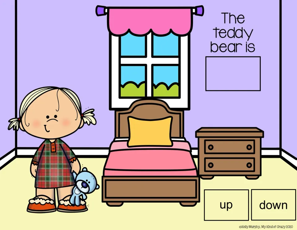 Spatial concepts slide: 'The teddy bear is' with up/down choices and a girl holding the bear near her feet.