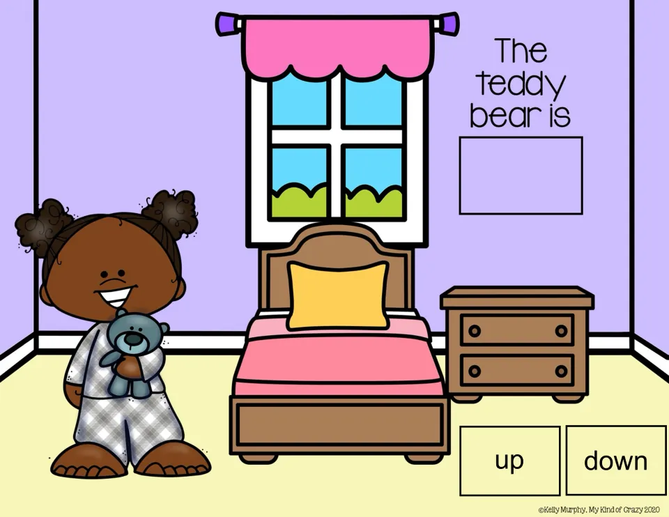 Spatial concepts slide: 'The teddy bear is' with up/down choices and a girl holding the bear at her chest.