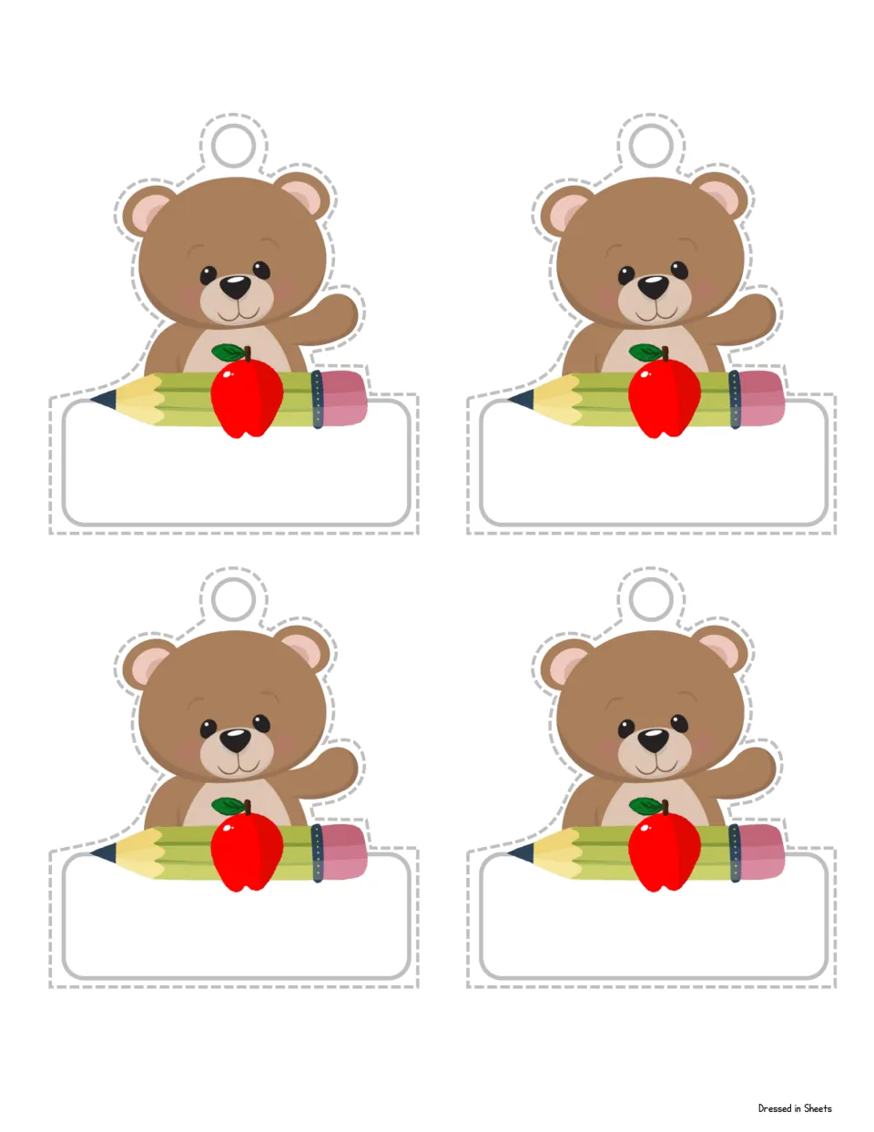 Name tag sheet: four blank tags, each a waving brown bear with a red apple and pencil above a space for a child's name