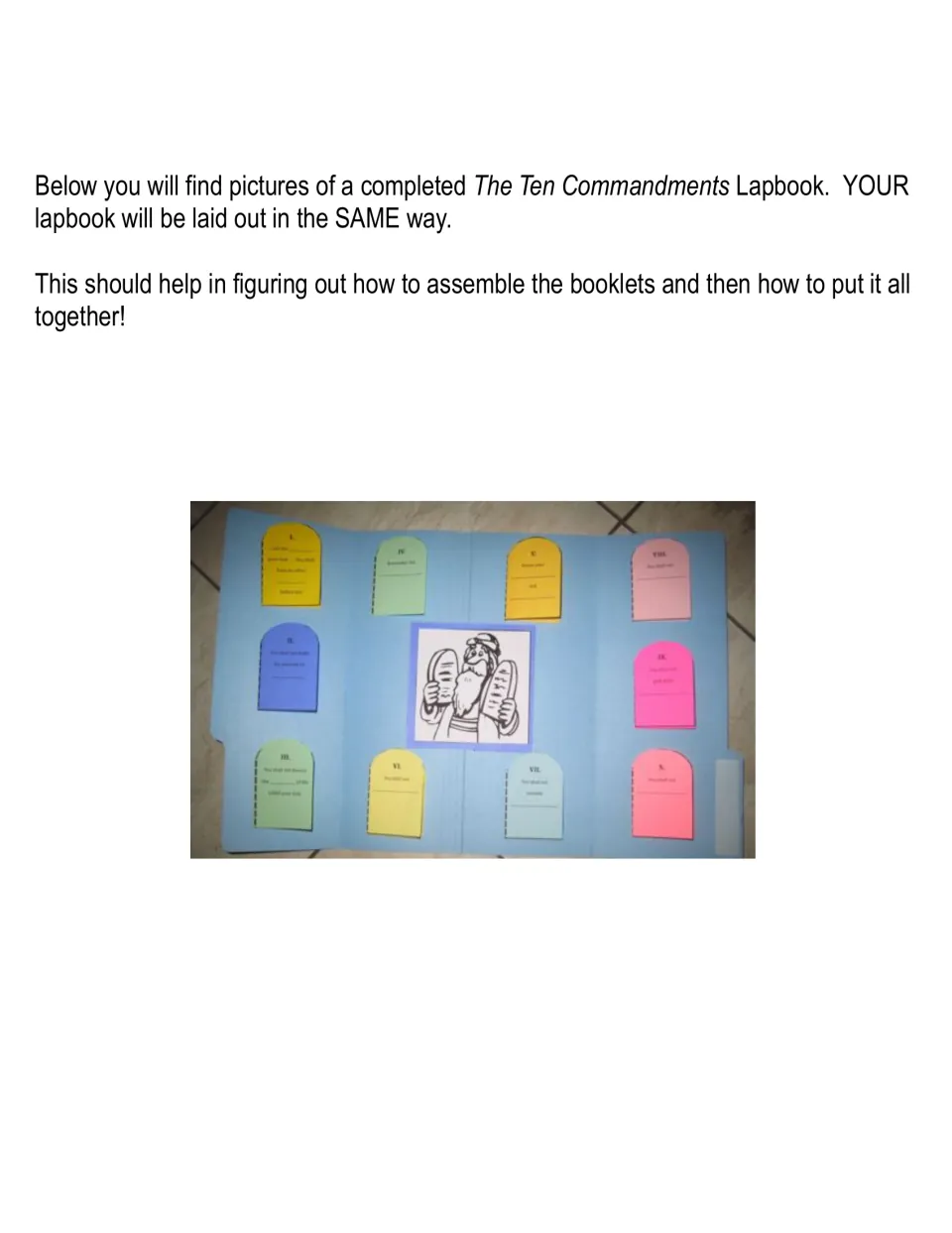 Completed lapbook photo: colored tablet booklets for each commandment around a central picture of Moses with the tablets