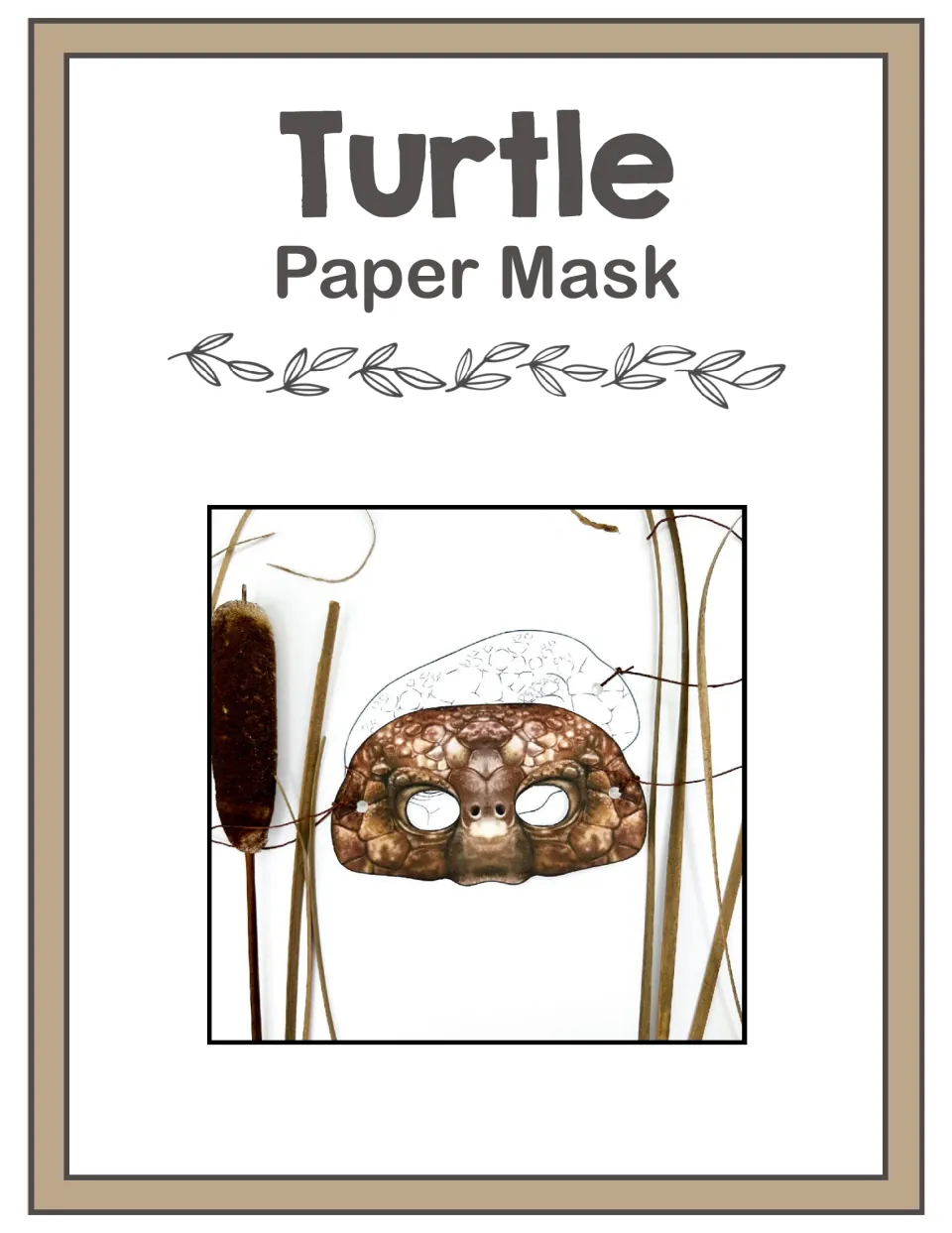 Turtle Paper Mask cover: photo of a finished realistic brown turtle mask tied with string, beside cattails and reeds