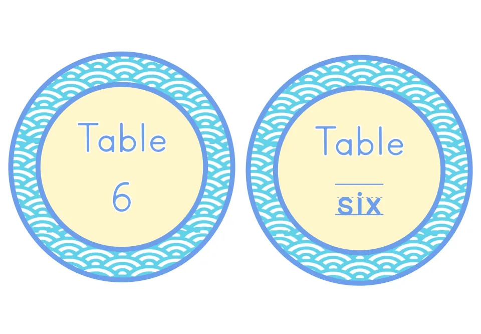 Table 6 signs: round wave-design labels reading Table 6 with a numeral and Table six with the number word on a writing line