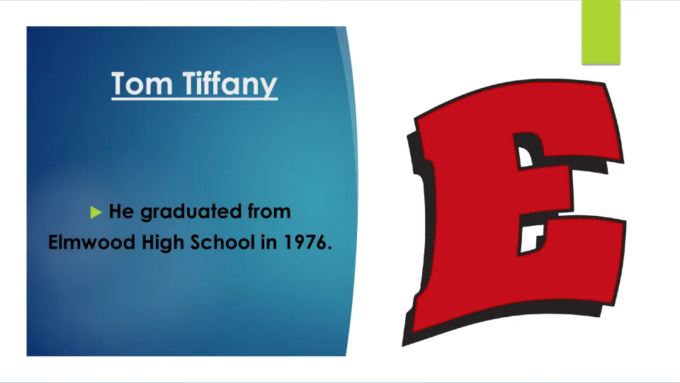 Biography slide recording Tom Tiffany’s graduation from Elmwood High School in 1976, with the school’s E logo