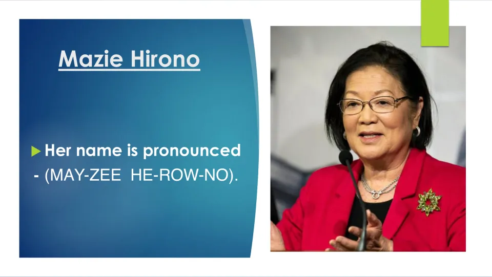 Name pronunciation slide giving Mazie Hirono as MAY-ZEE HE-ROW-NO, shown with a photo of her speaking at a microphone