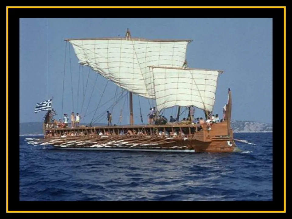 Trireme presentation slide featuring a ship afloat with two raised sails, extended oars, and people aboard