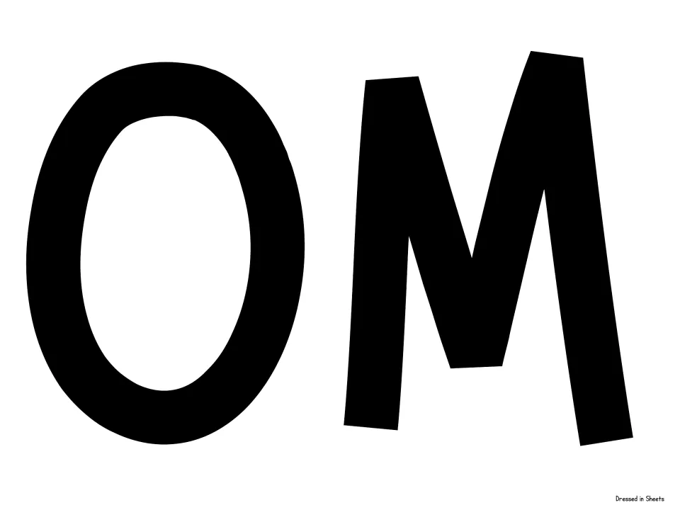 Cut-out piece for the welcome banner: large black capital letters O and M, continuing the word WELCOME