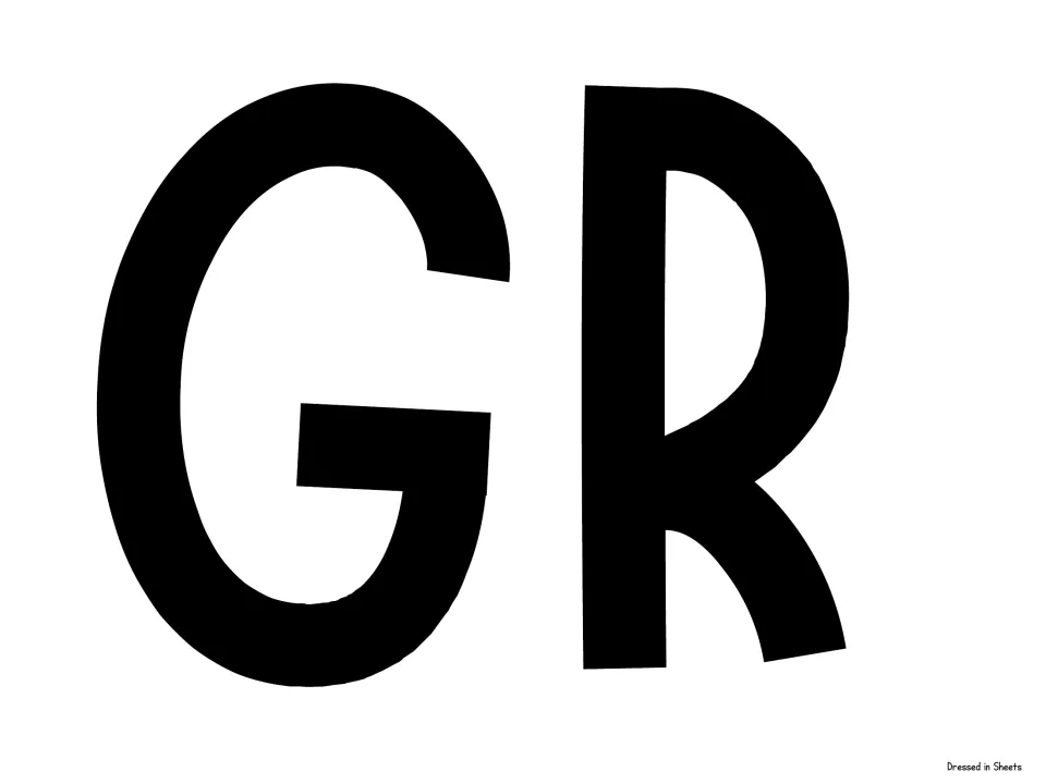 Cut-out piece for the welcome banner: large black capital letters G and R that begin the word GRADE