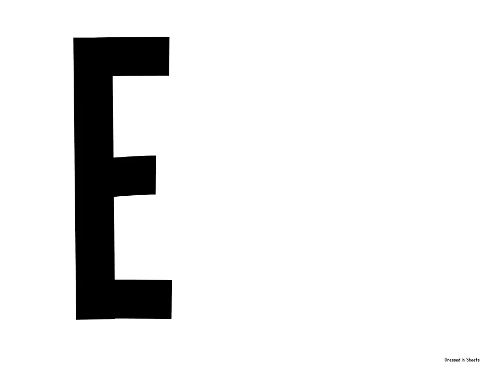 Cut-out piece for the welcome banner: a single large black capital letter E that ends the word GRADE