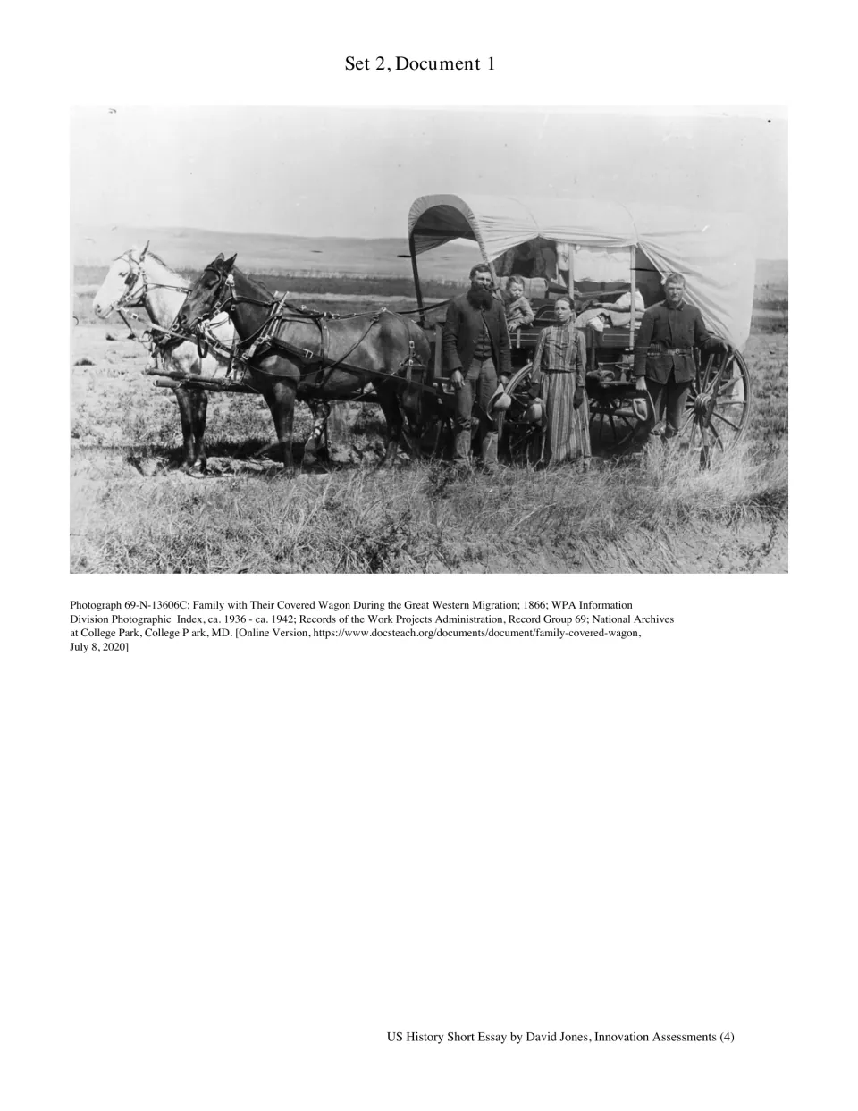 Great Western Migration photograph, 1866: a family stands beside their horse-drawn covered wagon on open prairie