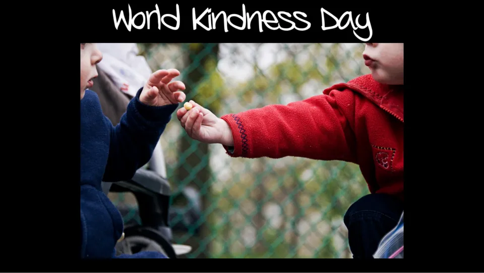 Opening slide titled 'World Kindness Day' shows one child offering a small item to another child.