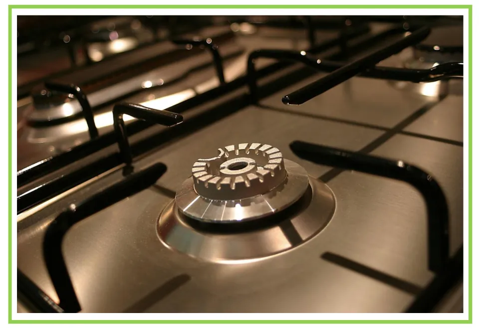 Appliance discussion and writing prompt card 4: a close-up of an unlit gas stove burner and metal grates