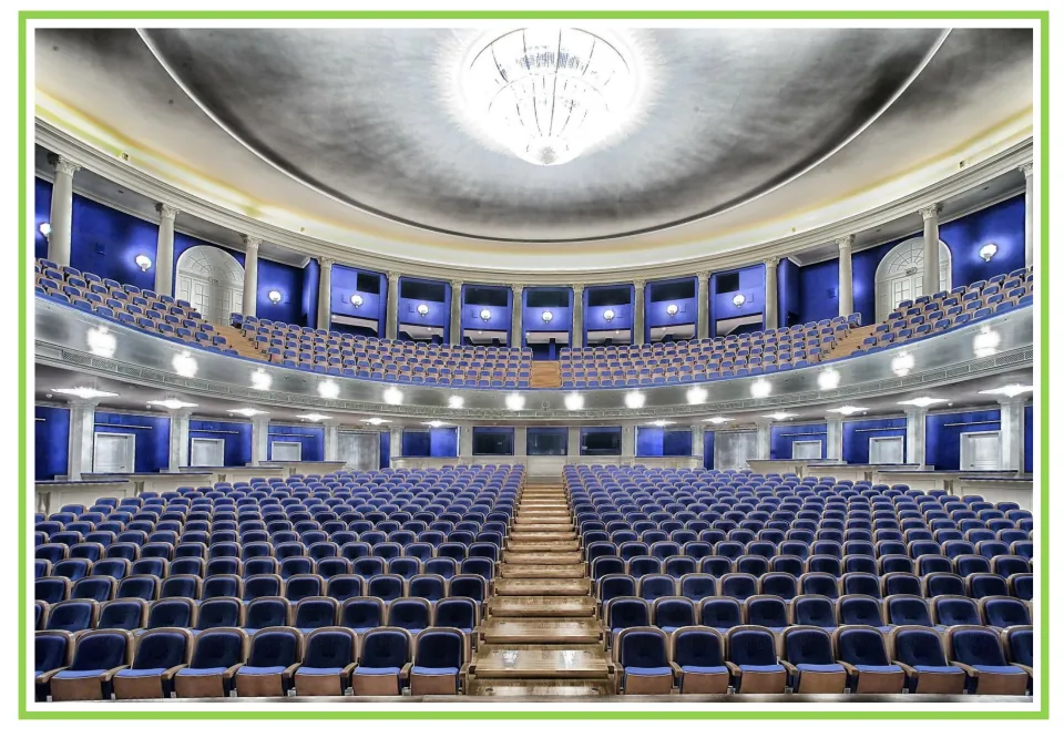 Hobbies writing and discussion prompt card showing a theater auditorium with blue seats and a balcony