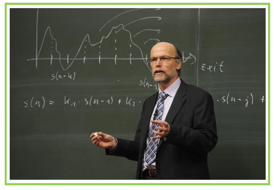 Lecture flashcard: a lecturer in a suit speaks at a chalkboard with a graph and an s(n) equation, a scene to discuss