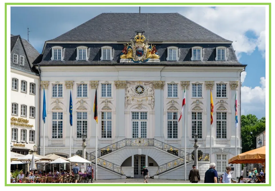 Building discussion and writing prompt card 1: an ornate civic building with flags and an exterior staircase