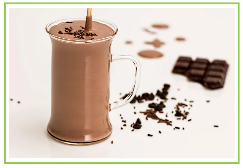 Coffee shop writing and discussion cue card 4: a chocolate drink in a glass mug beside chocolate pieces