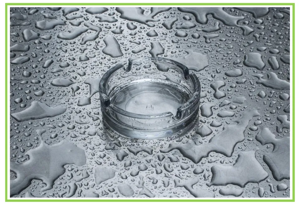 Coffee shop writing and discussion cue card 9: an empty glass ashtray on a surface covered in water drops