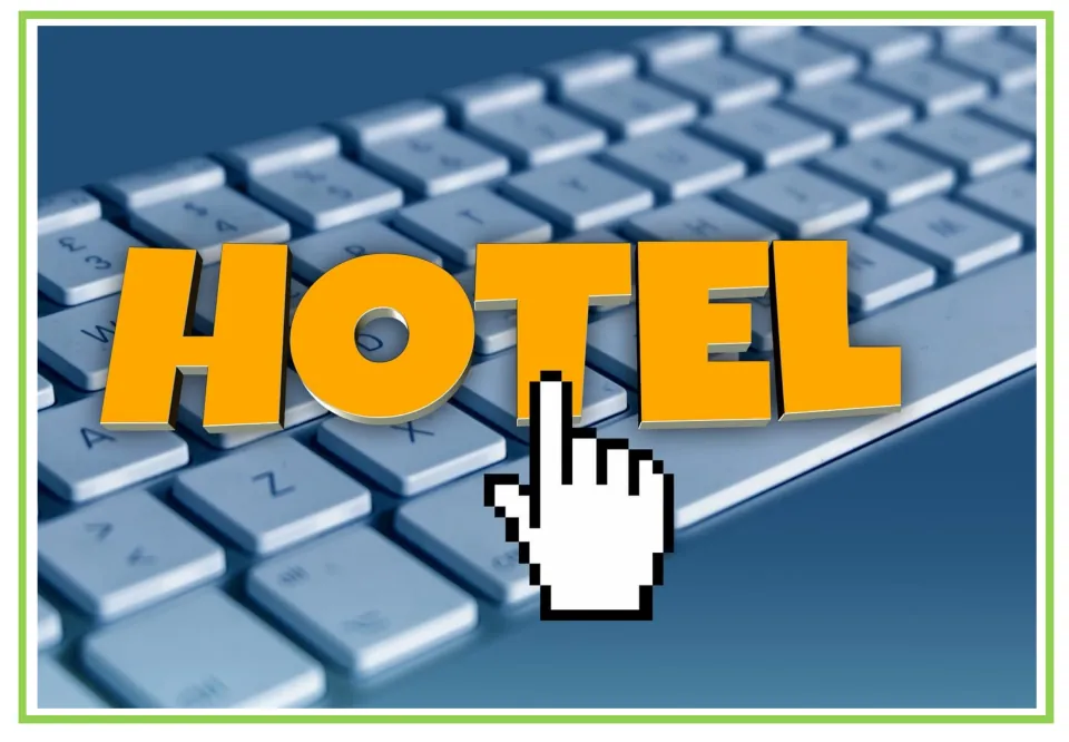 Hotel writing and discussion flashcard 6: the word 'HOTEL' over a computer keyboard with a hand cursor
