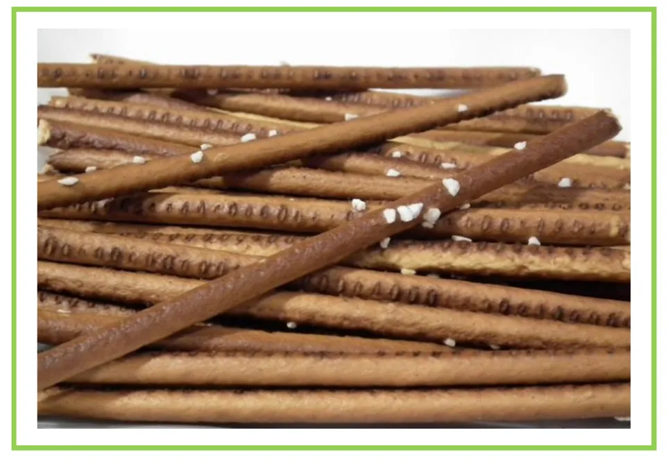 Salty snack flashcard 3 for writing prompts and discussions shows long pretzel sticks dotted with salt.