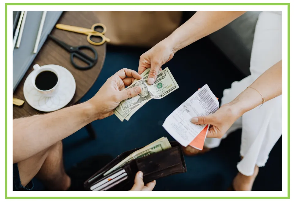 Shopping discussion and writing prompt card 8: hands exchanging paper money beside a wallet and receipt