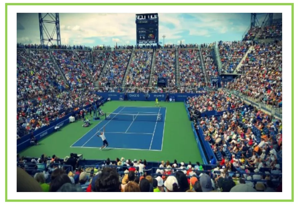 Tennis writing and discussion flashcard showing a player serving on a court surrounded by spectators