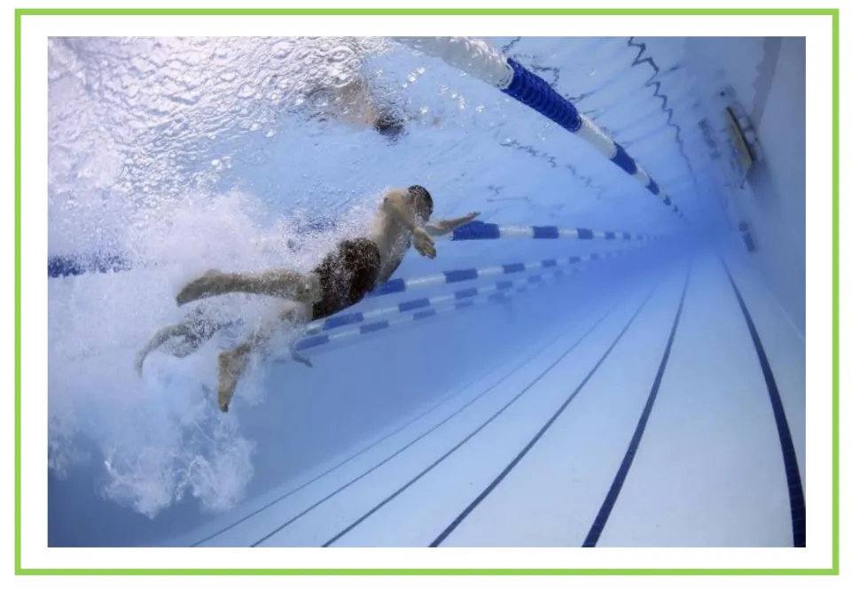 Swimming writing and discussion flashcard showing an underwater view of swimmers racing in pool lanes