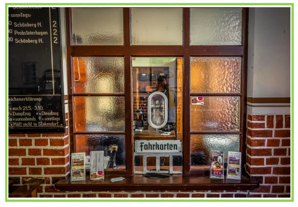 Train writing and discussion prompt card 9: a station ticket window labeled Fahrkarten (tickets)